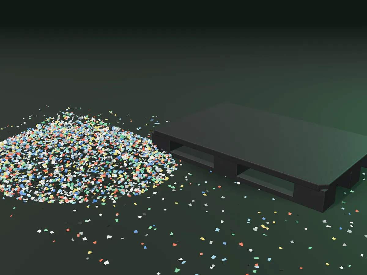 Recycled plastic flakes next to a black plastic pallet (3D render)